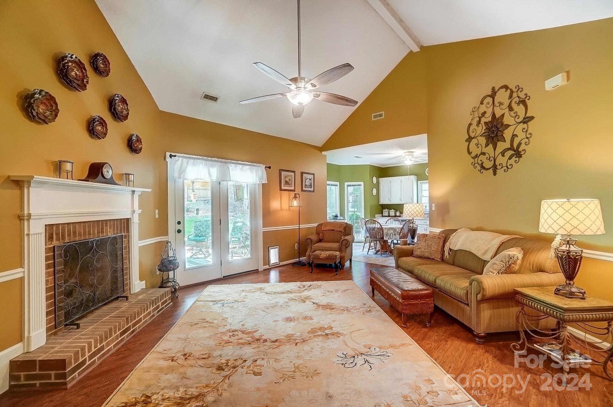 3063 River Ridge Drive Gastonia, NC 28056 - Photo 8 of 42 a living room with furniture and a fireplace