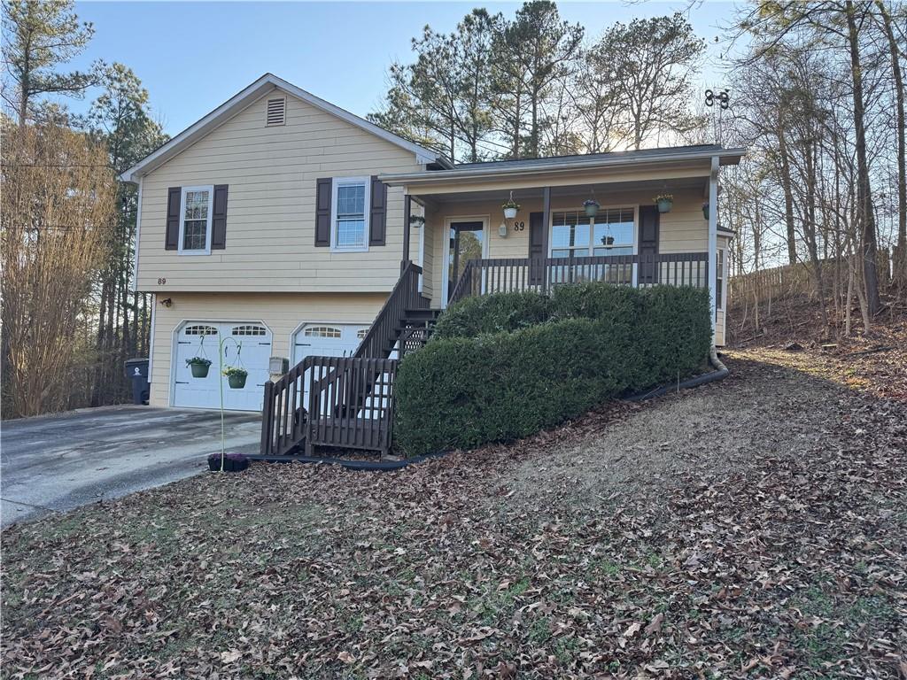 89 Cottonwood Loop Dallas, GA 30132 - Photo 1 of 1 a front view of a house with garden