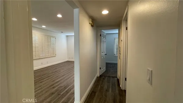 a view of a bathroom from the hallway