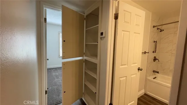 a bathroom with a shower and a glass door