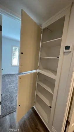 a view of an empty walk in closet