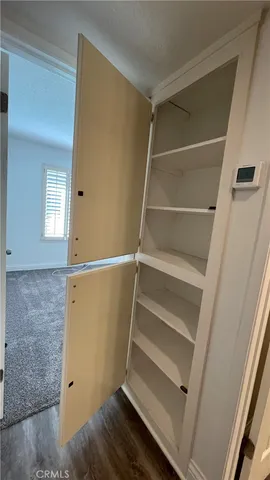a view of an empty walk in closet