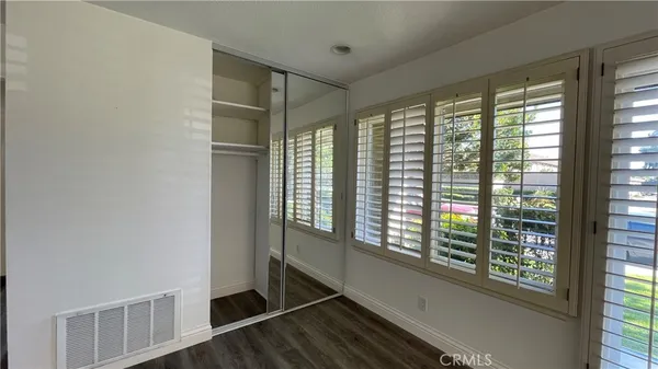 a view of an entryway with wooden floor