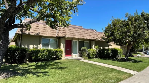 front view of a house with a garden