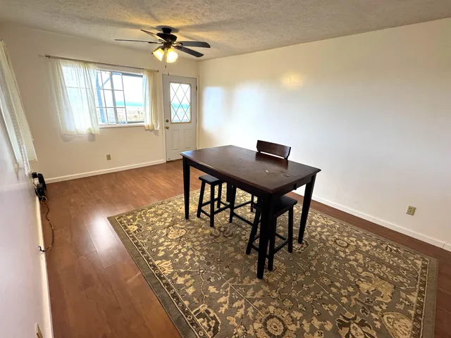 a view of a workspace with furniture