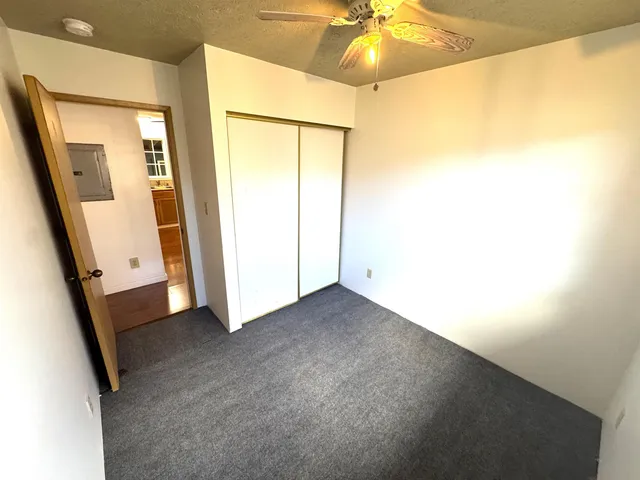 an empty room with a mirror