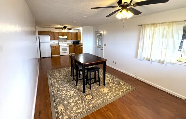 a kitchen with refrigerator and window