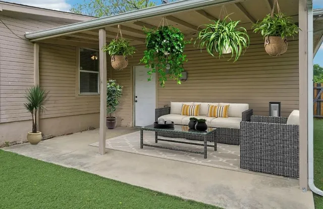 a view of a two chairs in the patio