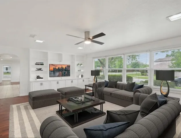 a living room with furniture and a large window