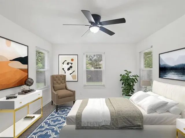 a bedroom with a large bed and a flat screen tv