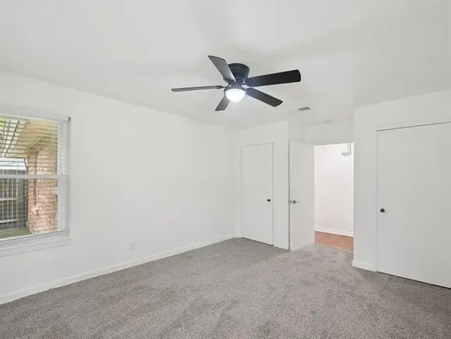 a view of a ceiling fan in a room