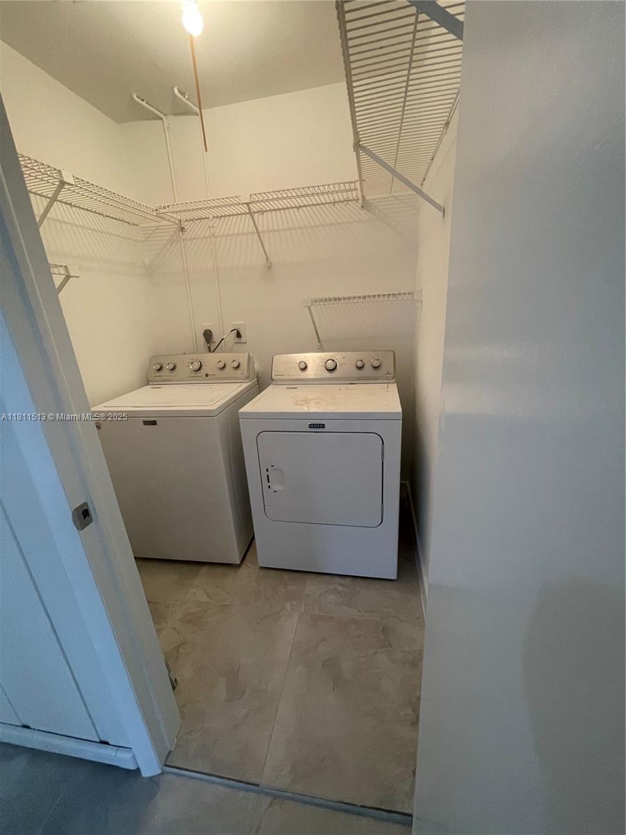 413 Saxony Way, Unit 413 Delray Beach, FL 33446 - Photo 11 of 14 a utility room with dryer and washer