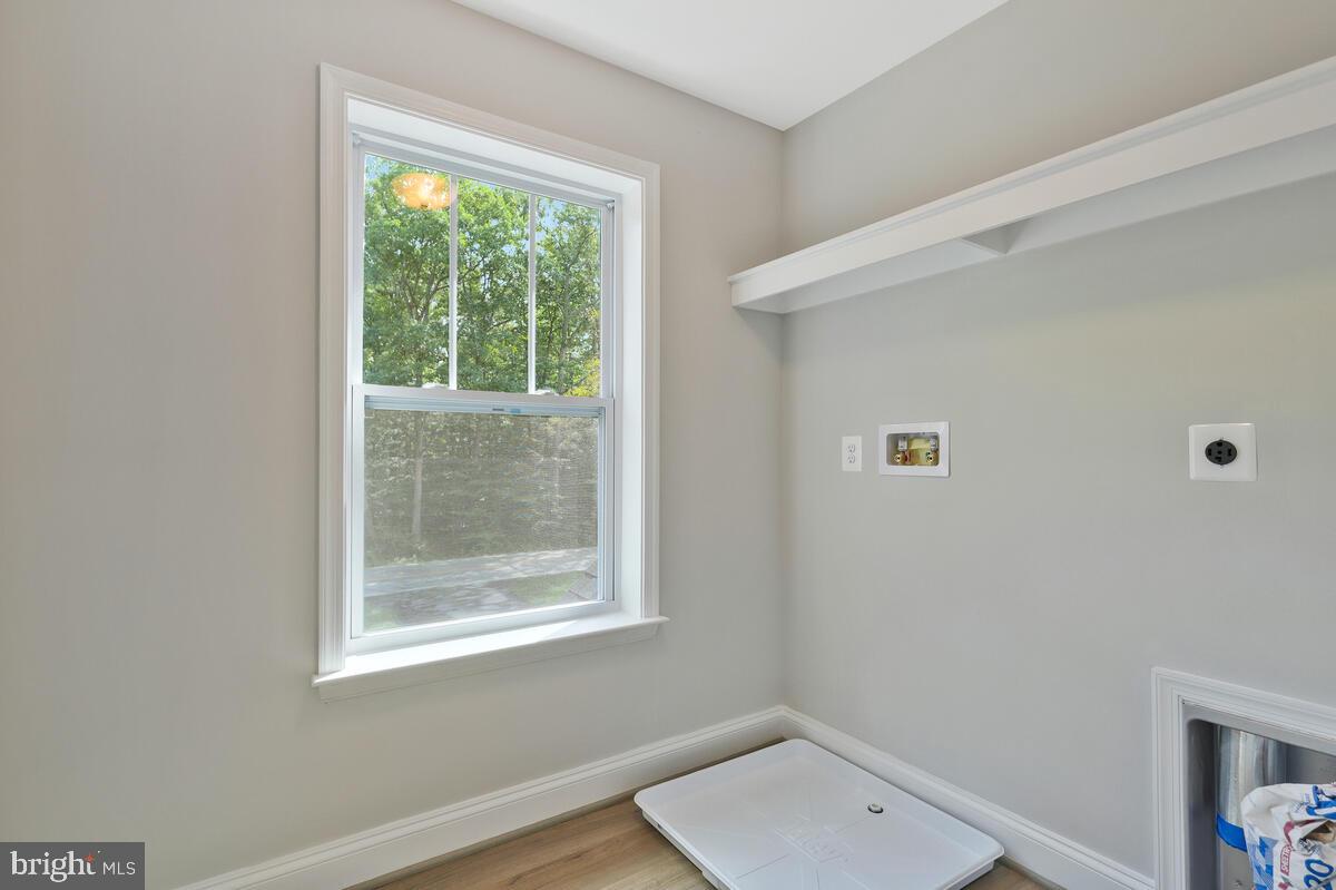 6780 Hungerford Road Bryans Road, MD 20616 - Photo 41 of 54 Bright laundry Room w/shelf on upper level