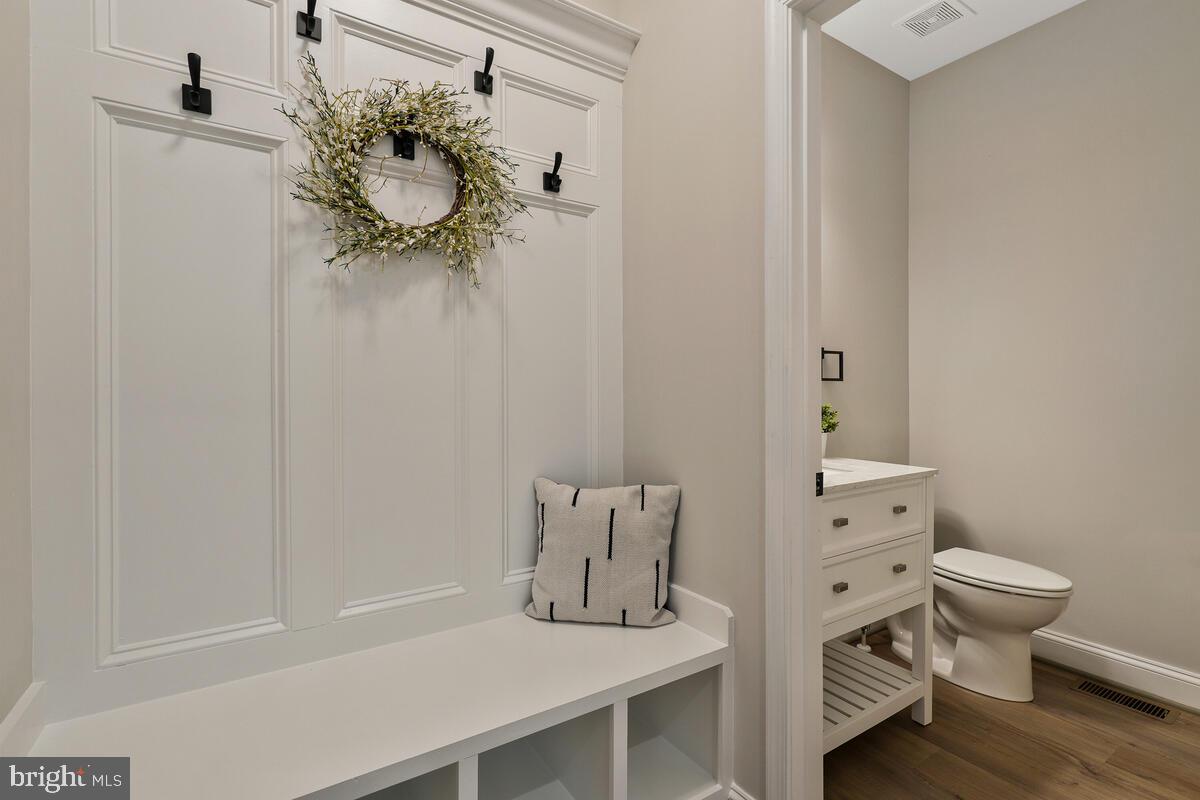 6780 Hungerford Road Bryans Road, MD 20616 - Photo 43 of 54 Custom bench w/ hooks and cubbies for storage