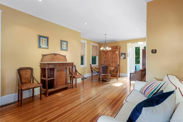 a living room with furniture and a chair
