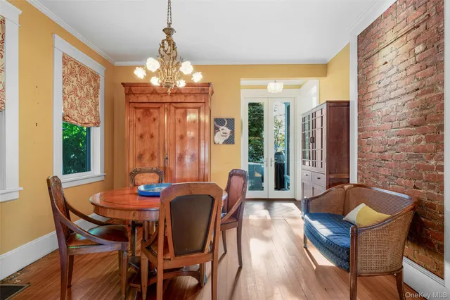 a view of a dining room with furniture and window