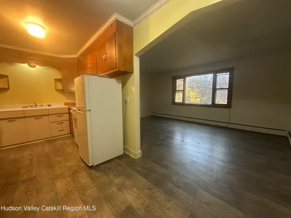 a kitchen with a sink cabinets and appliances