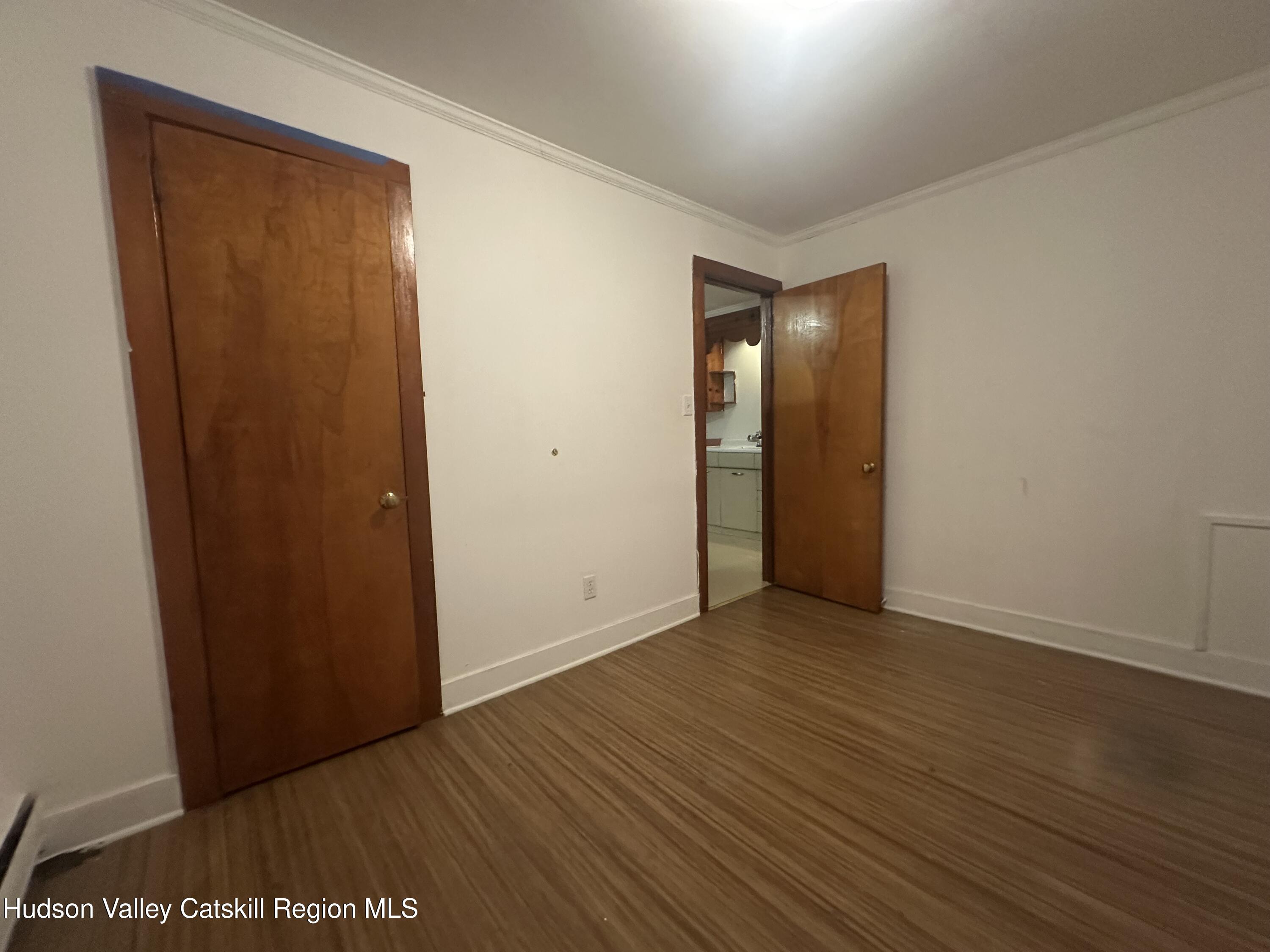 6140 Highway 9G, Unit 4 Hudson, NY 12534 - Photo 8 of 9 an empty room with wooden floor and closet area