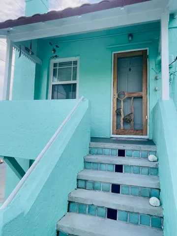 a view of entryway and hall with a window