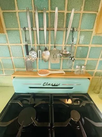 a kitchen with a sink appliances and cabinets
