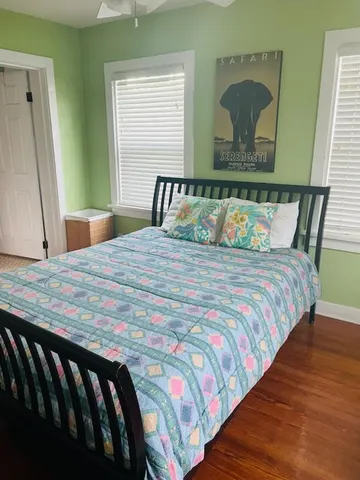 a bathroom with a toilet a sink and a mirror