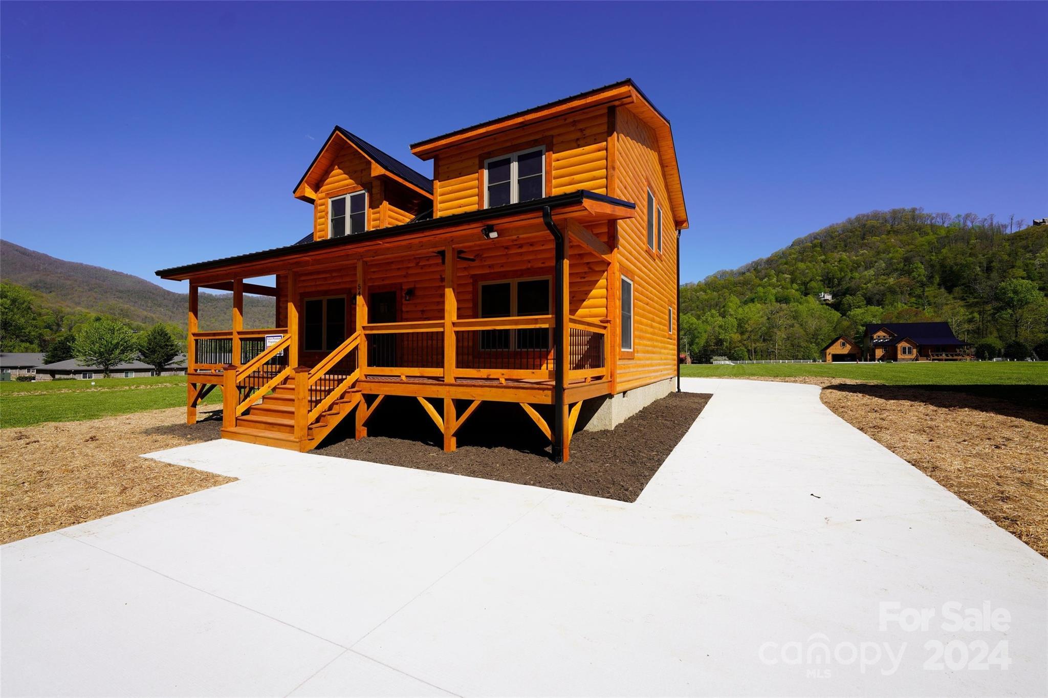 54 Alex Ridge Maggie Valley, NC 28751 - Photo 1 of 35 front view of a house with a yard