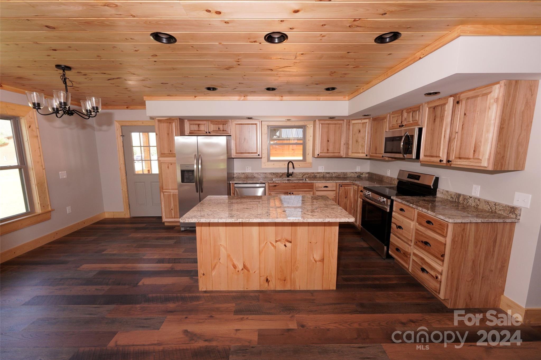 54 Alex Ridge Maggie Valley, NC 28751 - Photo 12 of 35 a kitchen with stainless steel appliances granite countertop a stove and a sink