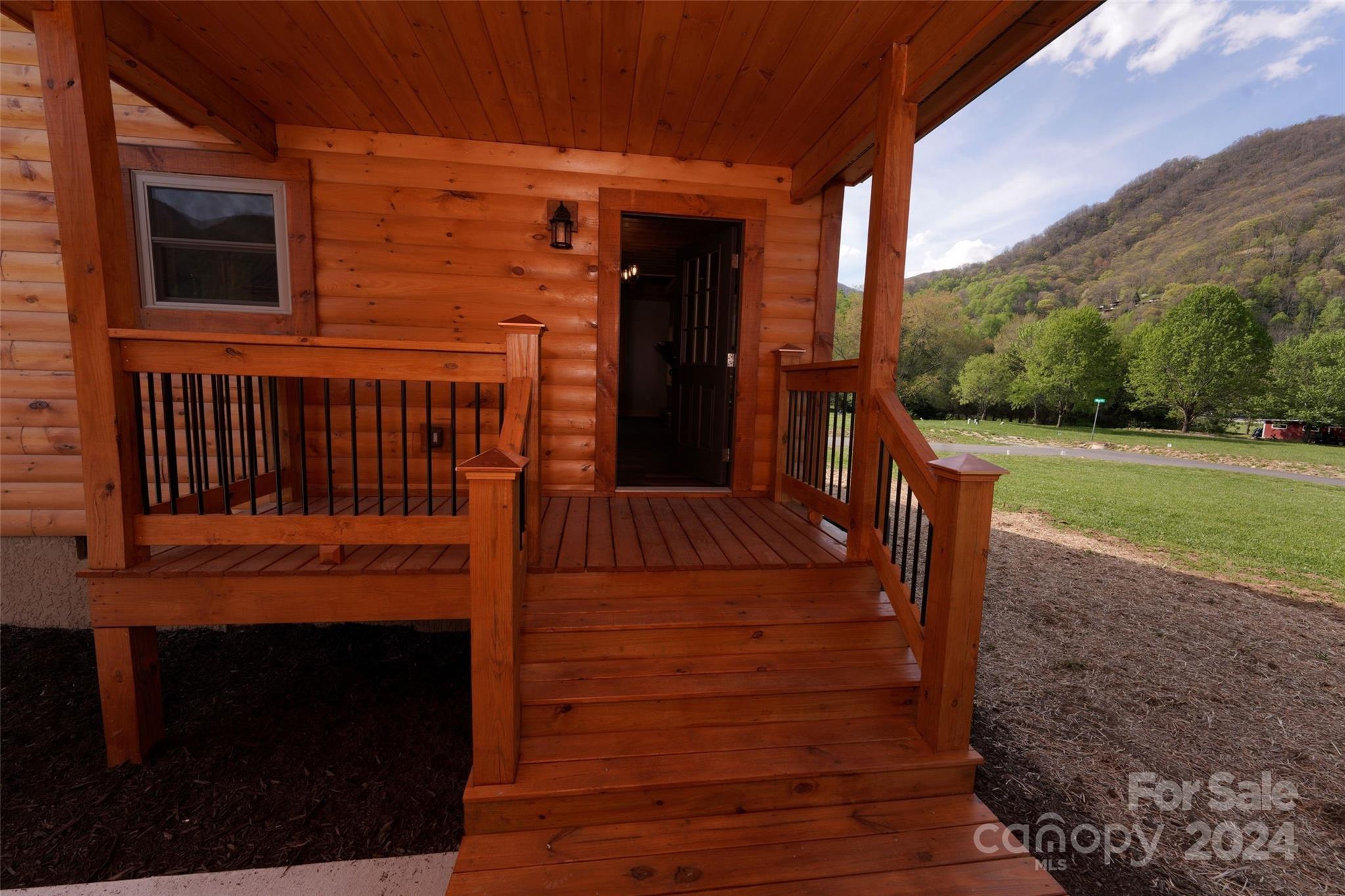 54 Alex Ridge Maggie Valley, NC 28751 - Photo 22 of 35 a view of a house with backyard