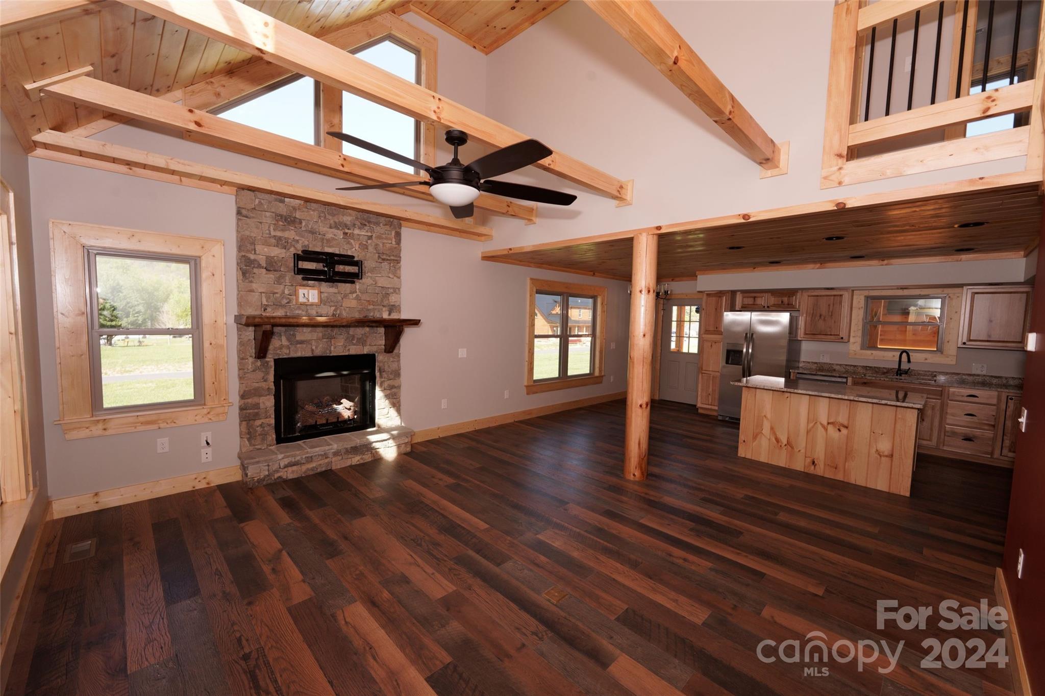 54 Alex Ridge Maggie Valley, NC 28751 - Photo 8 of 35 a view of living room and kitchen with furniture wooden floor and window
