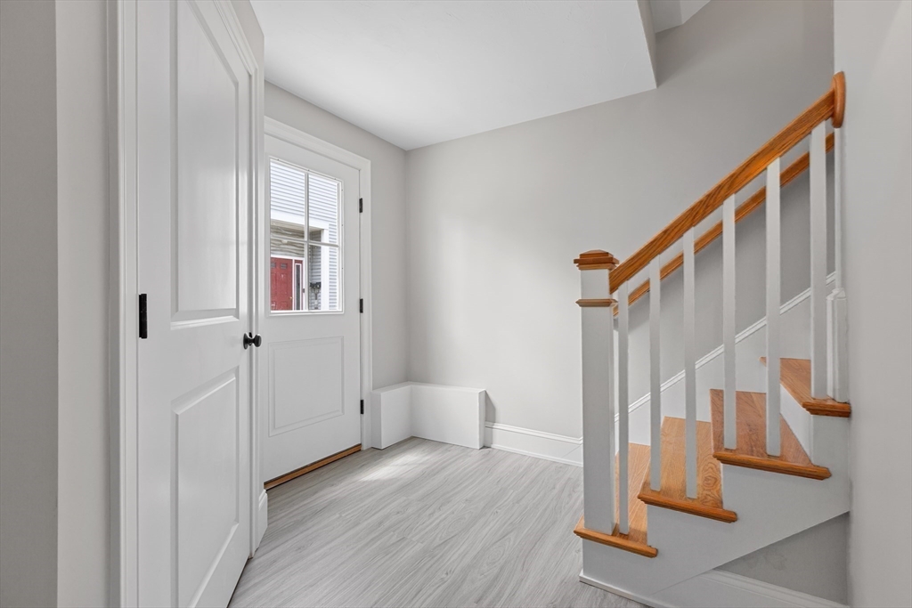 22 Pleasant Street, Unit B Mansfield, MA 02048 - Photo 23 of 26 a view of front door with stairs