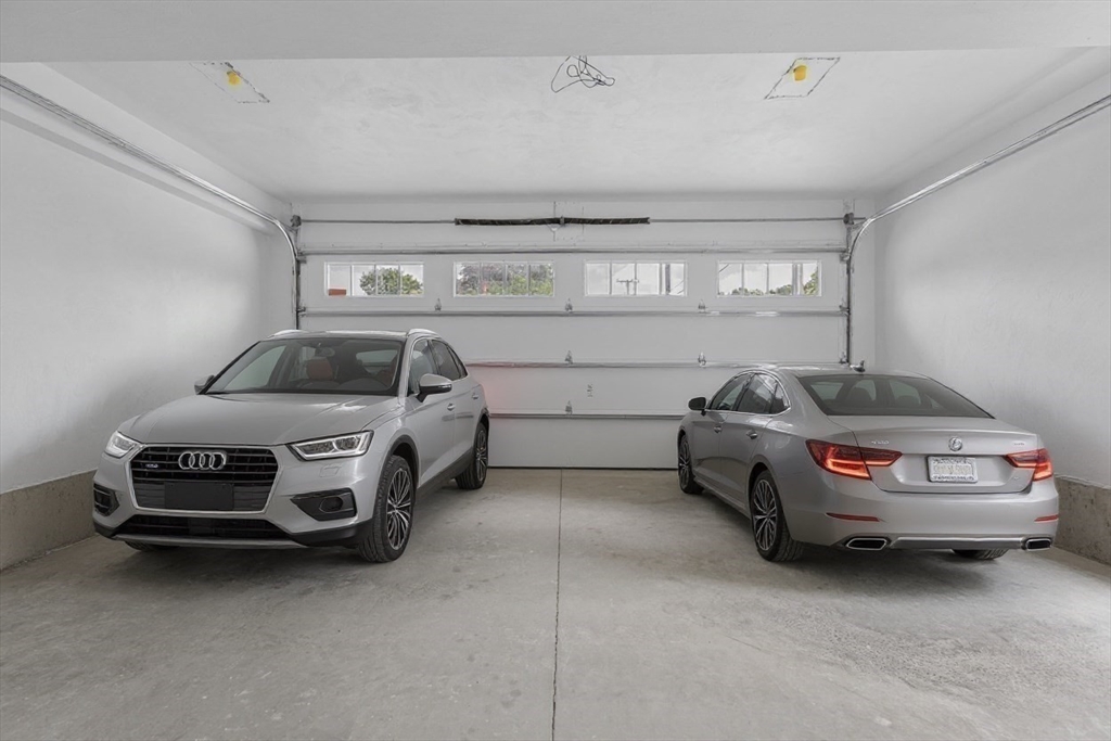 22 Pleasant Street, Unit B Mansfield, MA 02048 - Photo 24 of 26 a car parked in a garage