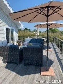a view of a balcony with wooden fence and floor