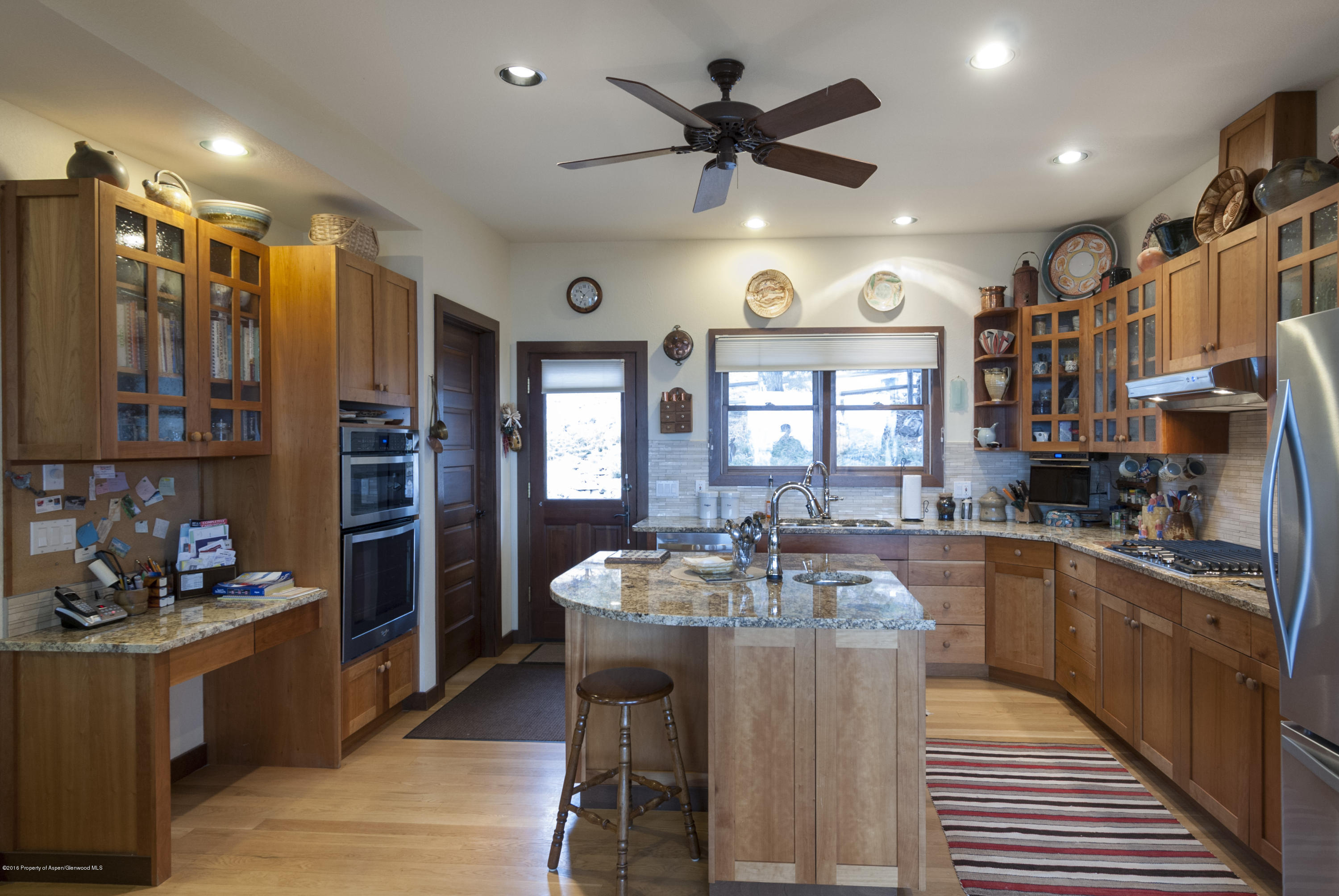 550 Wooden Deer Road Carbondale, CO 81623 - Photo 3 of 21 a kitchen with stainless steel appliances granite countertop a sink stove and refrigerator