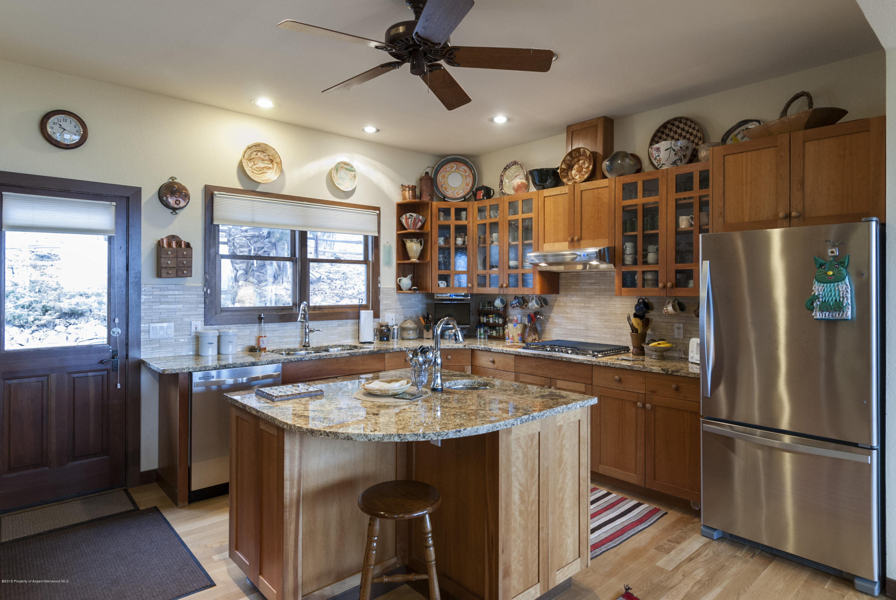 550 Wooden Deer Road Carbondale, CO 81623 - Photo 5 of 21 a kitchen with stainless steel appliances granite countertop a sink a stove and a refrigerator