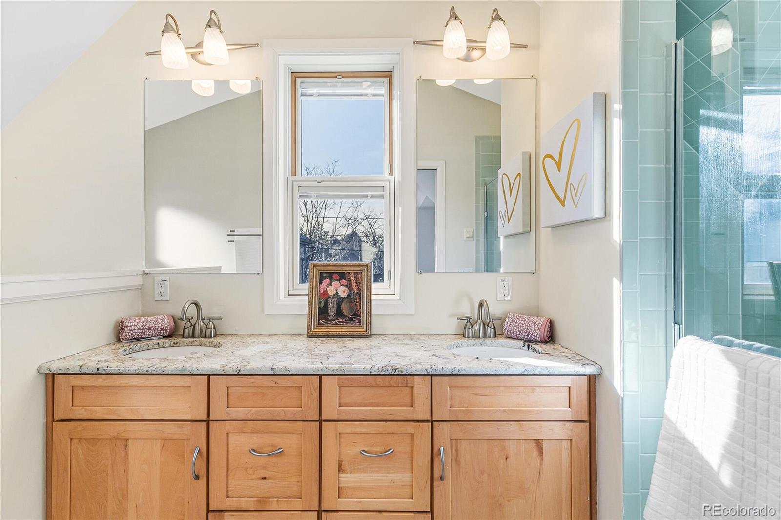 3885 Wolff Street Denver, CO 80212 - Photo 25 of 50 a bathroom with a granite countertop sink and a mirror