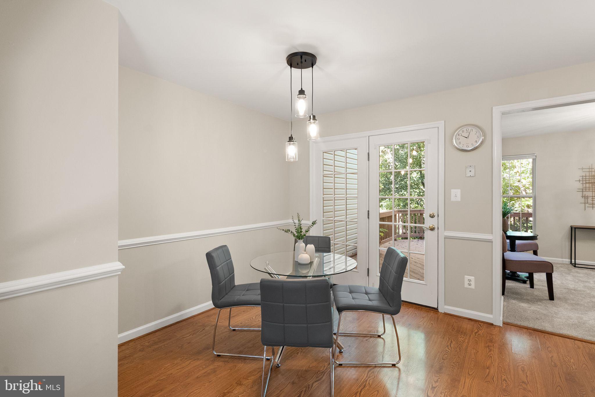 20544 Morningside Terrace Sterling, VA 20165 - Photo 15 of 54 a dining room with furniture and wooden floor