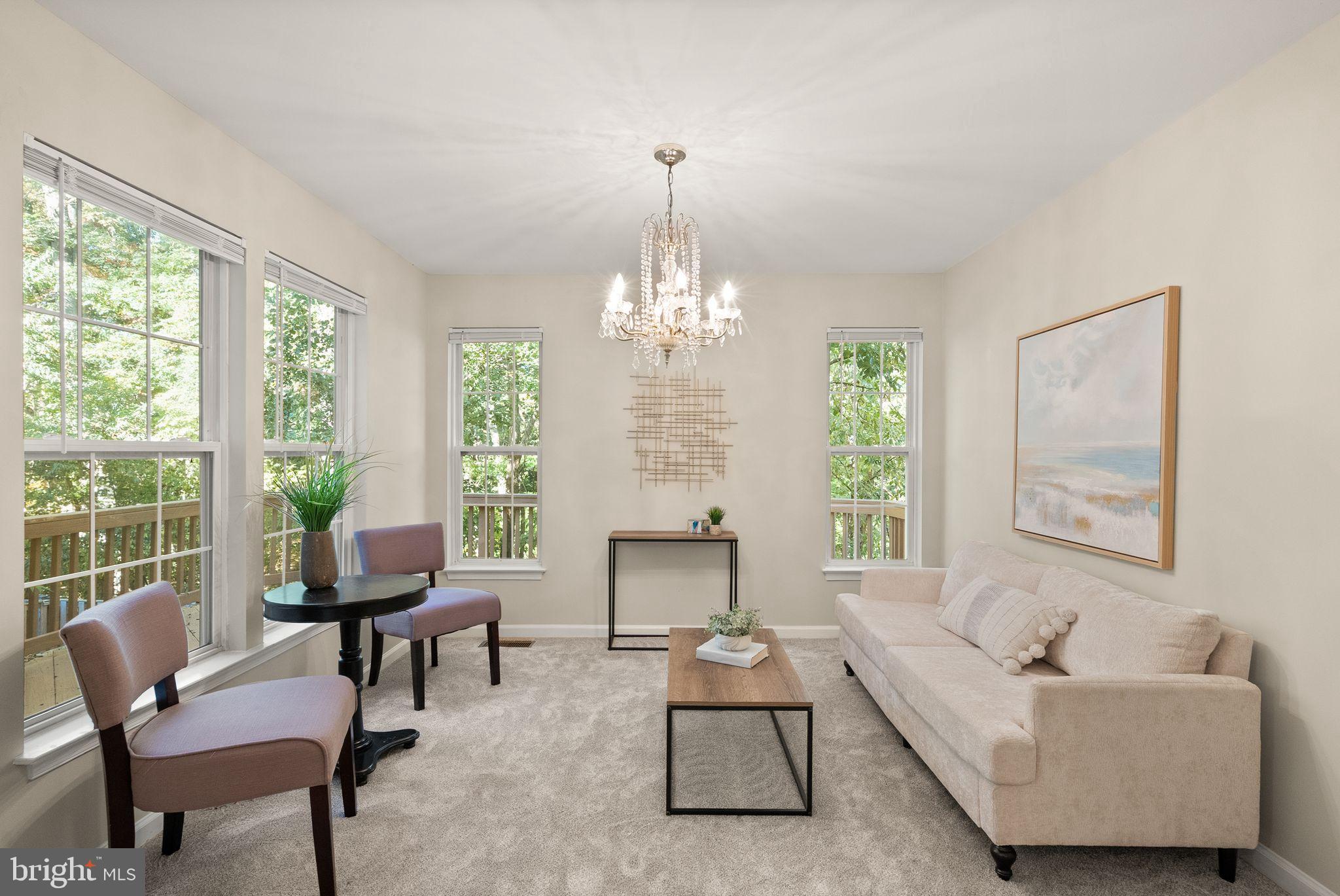 20544 Morningside Terrace Sterling, VA 20165 - Photo 16 of 54 a living room with furniture and a chandelier