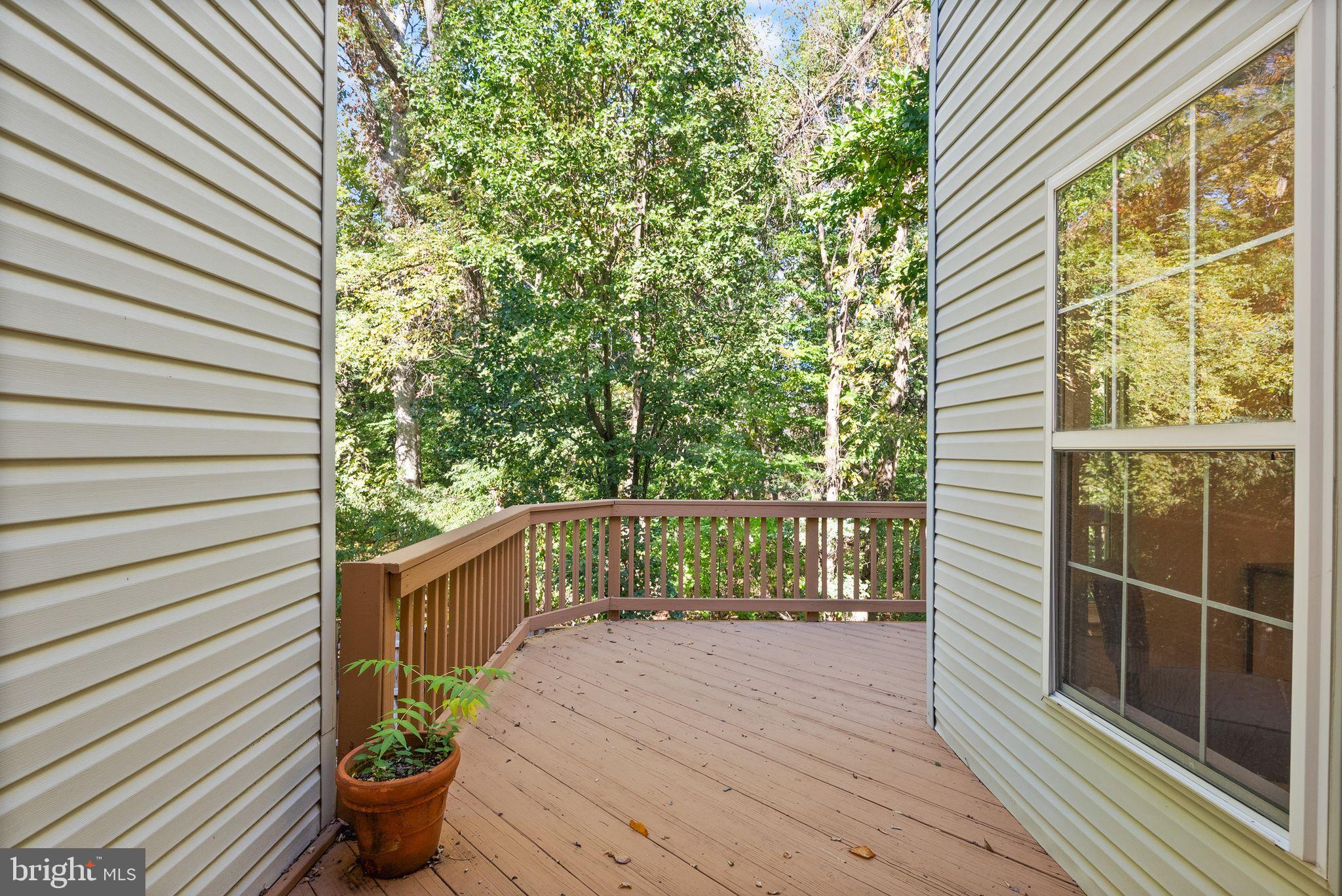 20544 Morningside Terrace Sterling, VA 20165 - Photo 18 of 54 a balcony with chairs and wooden fence