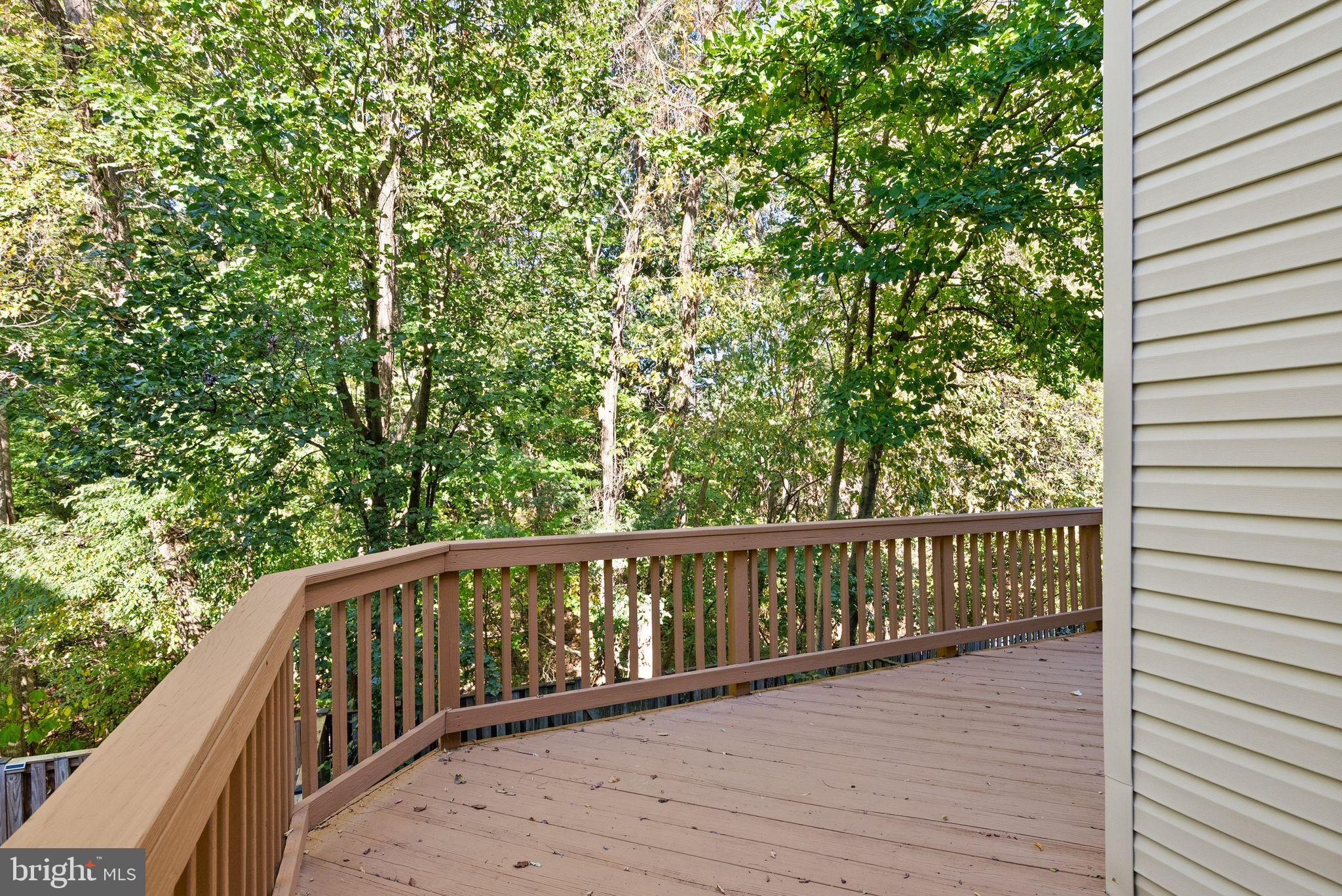 20544 Morningside Terrace Sterling, VA 20165 - Photo 19 of 54 a balcony with wooden floor and fence