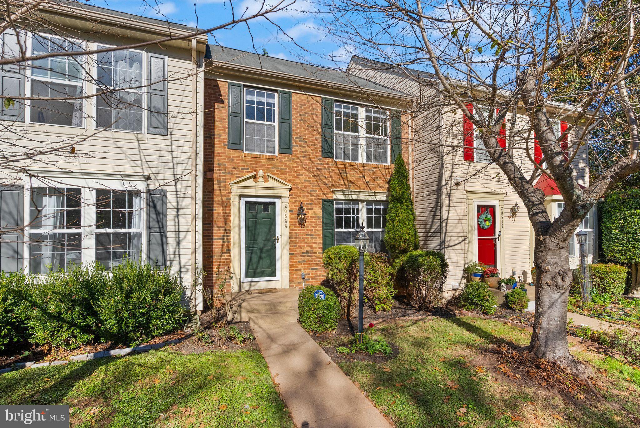20544 Morningside Terrace Sterling, VA 20165 - Photo 2 of 54 a front view of a house with a yard