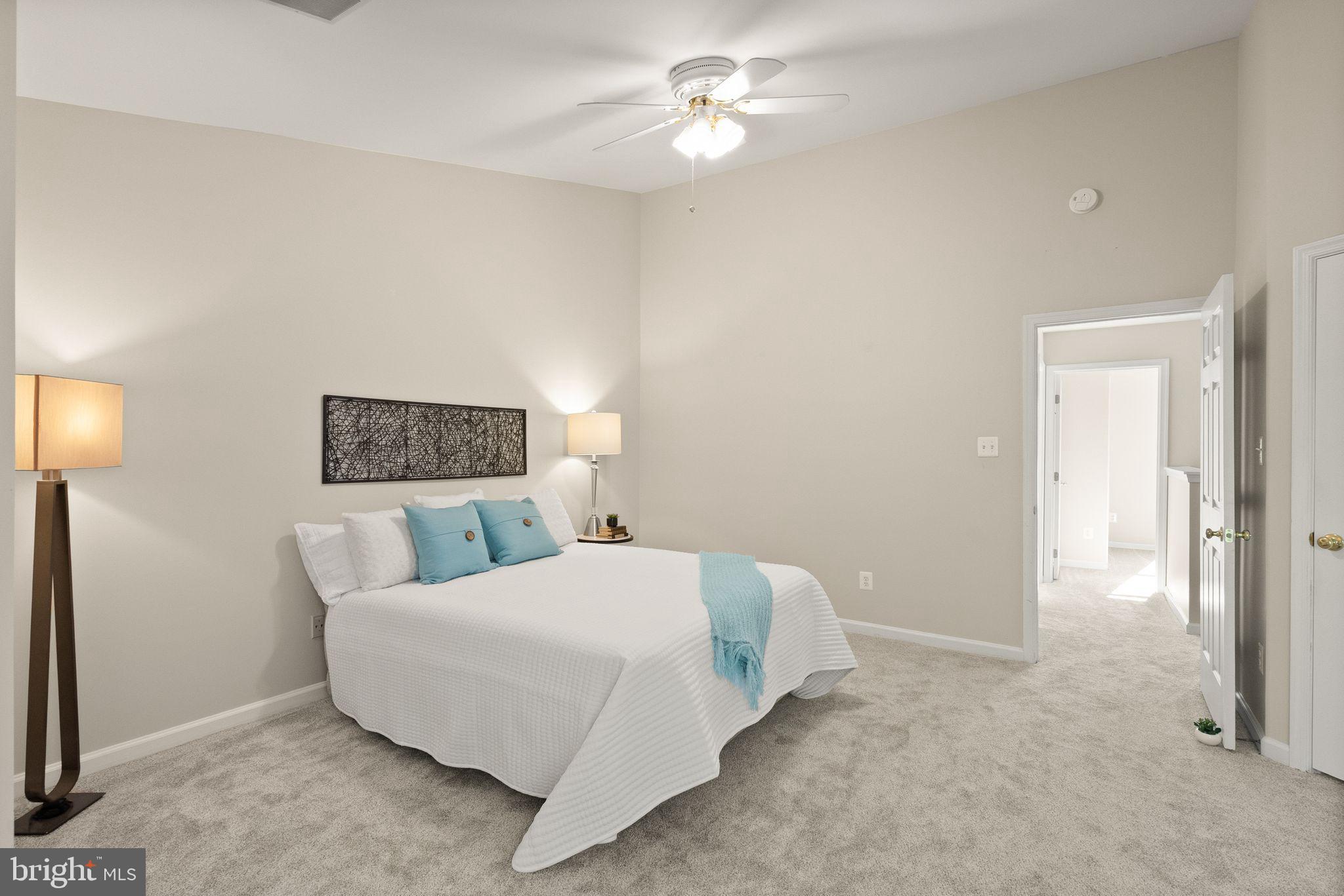 20544 Morningside Terrace Sterling, VA 20165 - Photo 28 of 54 a bedroom with a bed and a lamp