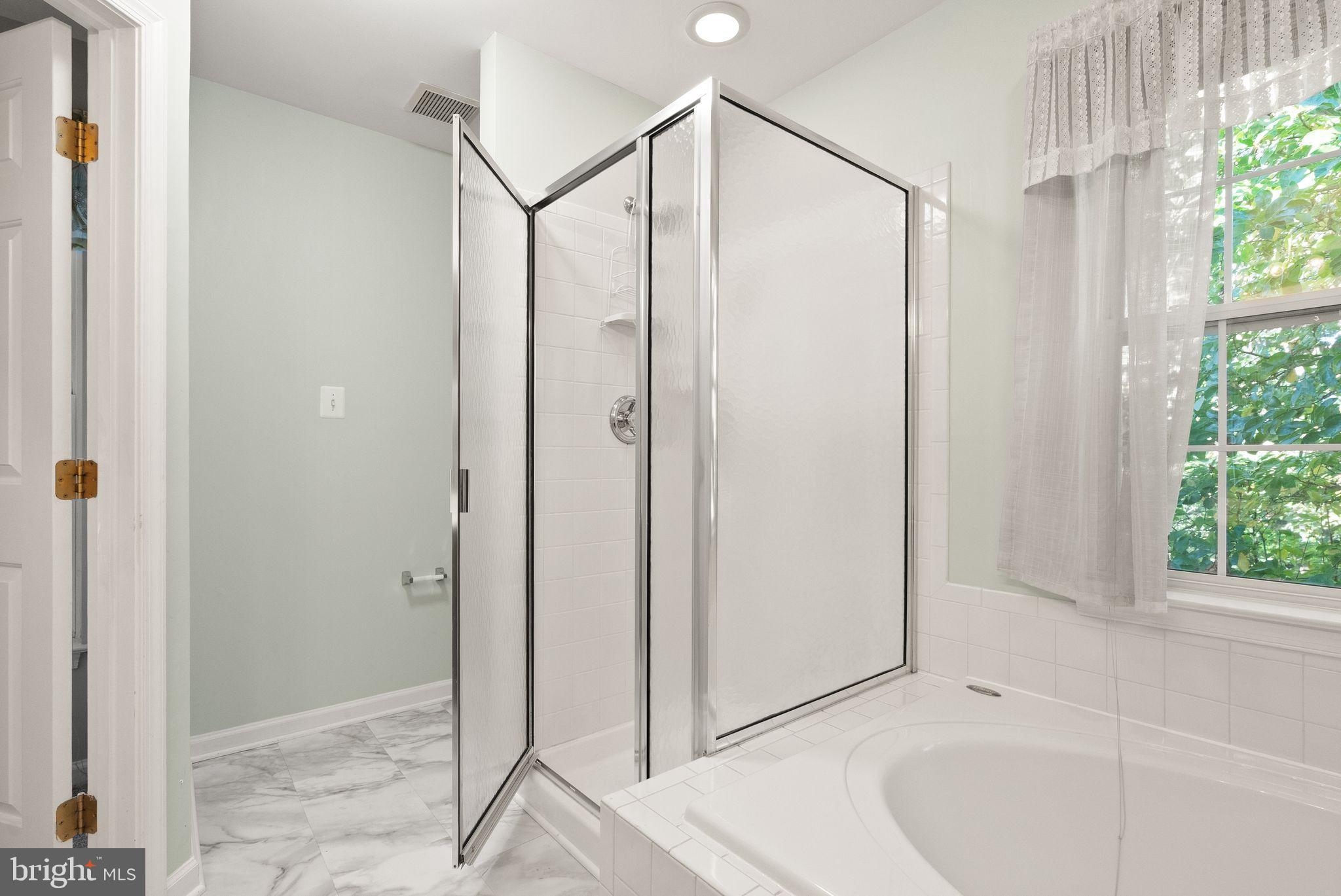 20544 Morningside Terrace Sterling, VA 20165 - Photo 31 of 54 a bathroom with a shower and a tub