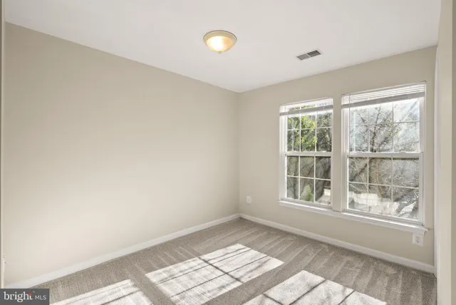 a view of an empty room and window