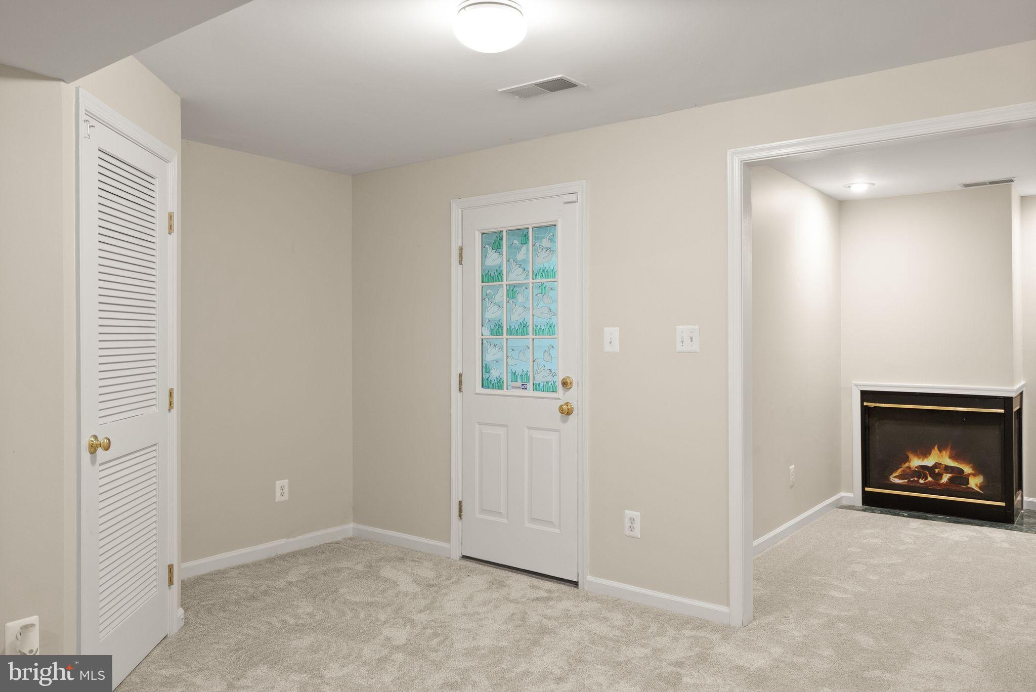 20544 Morningside Terrace Sterling, VA 20165 - Photo 42 of 54 a view of an empty room with fire place and a window