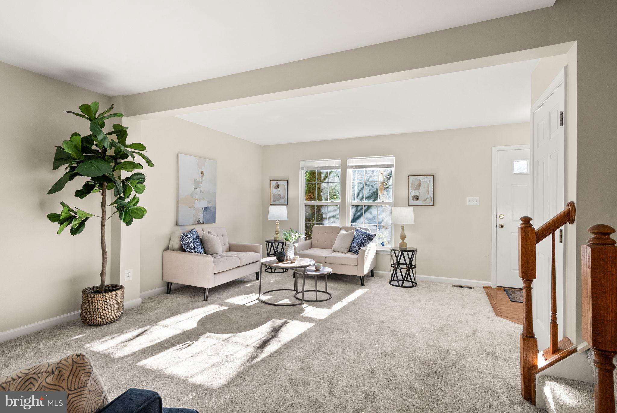 20544 Morningside Terrace Sterling, VA 20165 - Photo 8 of 54 a living room with furniture a potted plant and a large window