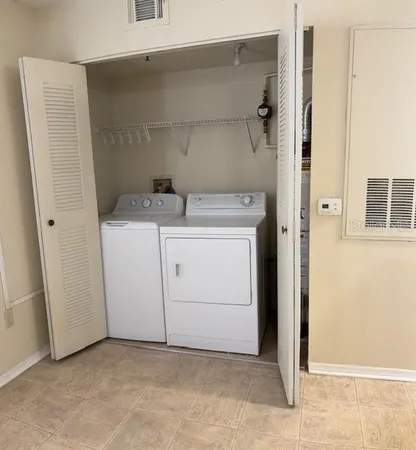 a utility room with dryer and washer