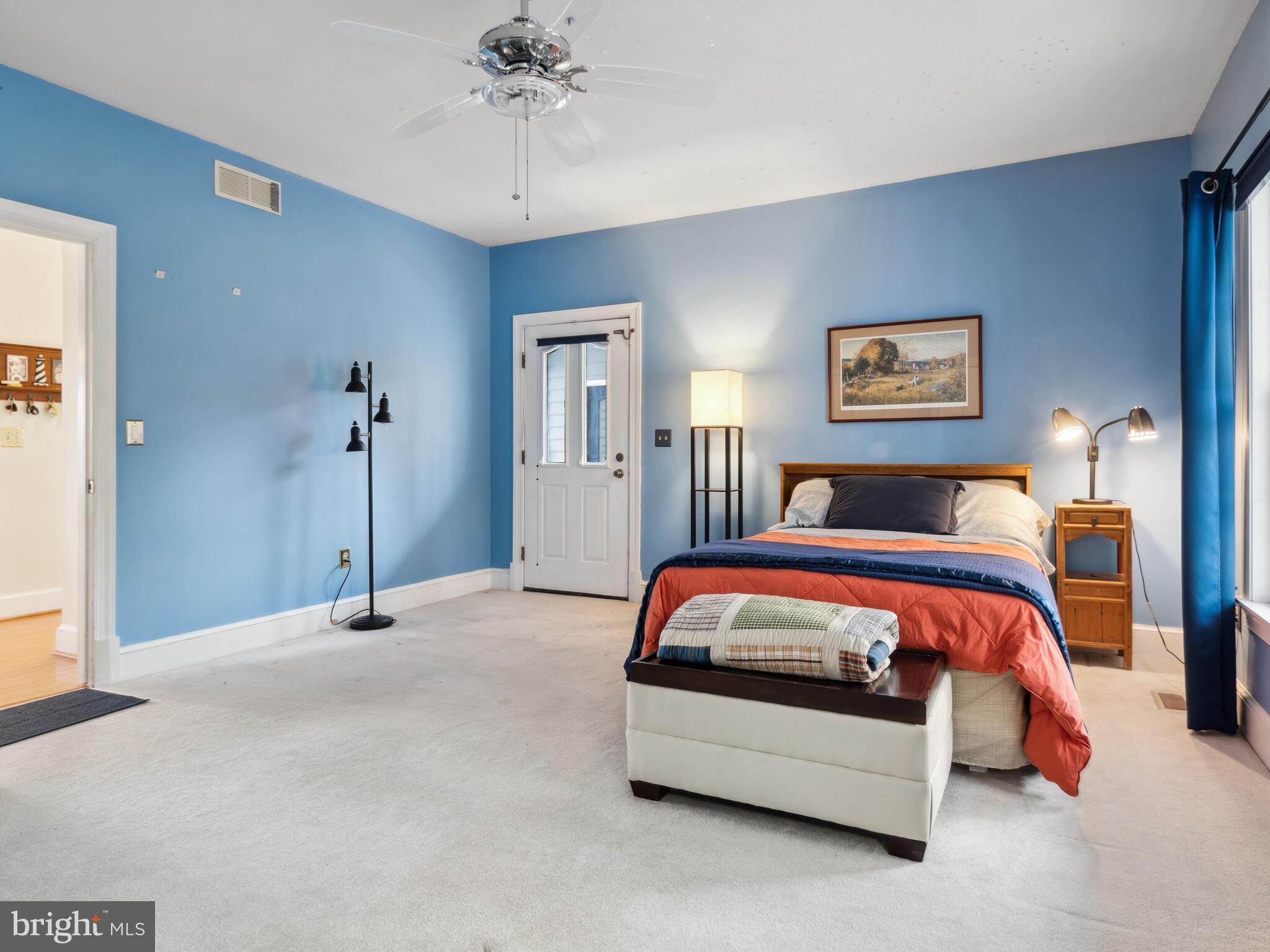 9191 Deepwater Point Road St. Michaels, MD 21663 - Photo 60 of 103 1st Floor Secondary Bedroom with exterior door