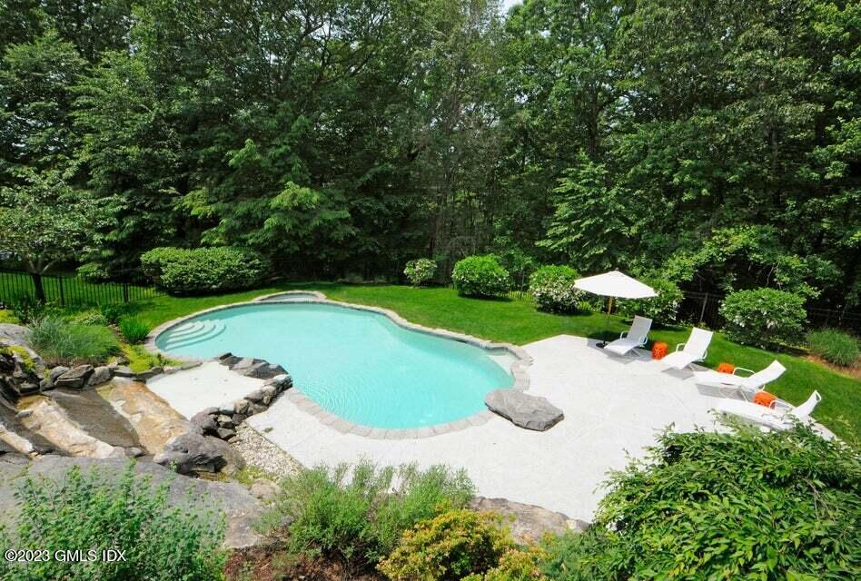 192 Bible Street Cos Cob, CT 06807 - Photo 12 of 32 an aerial view of a house with a garden and swimming pool