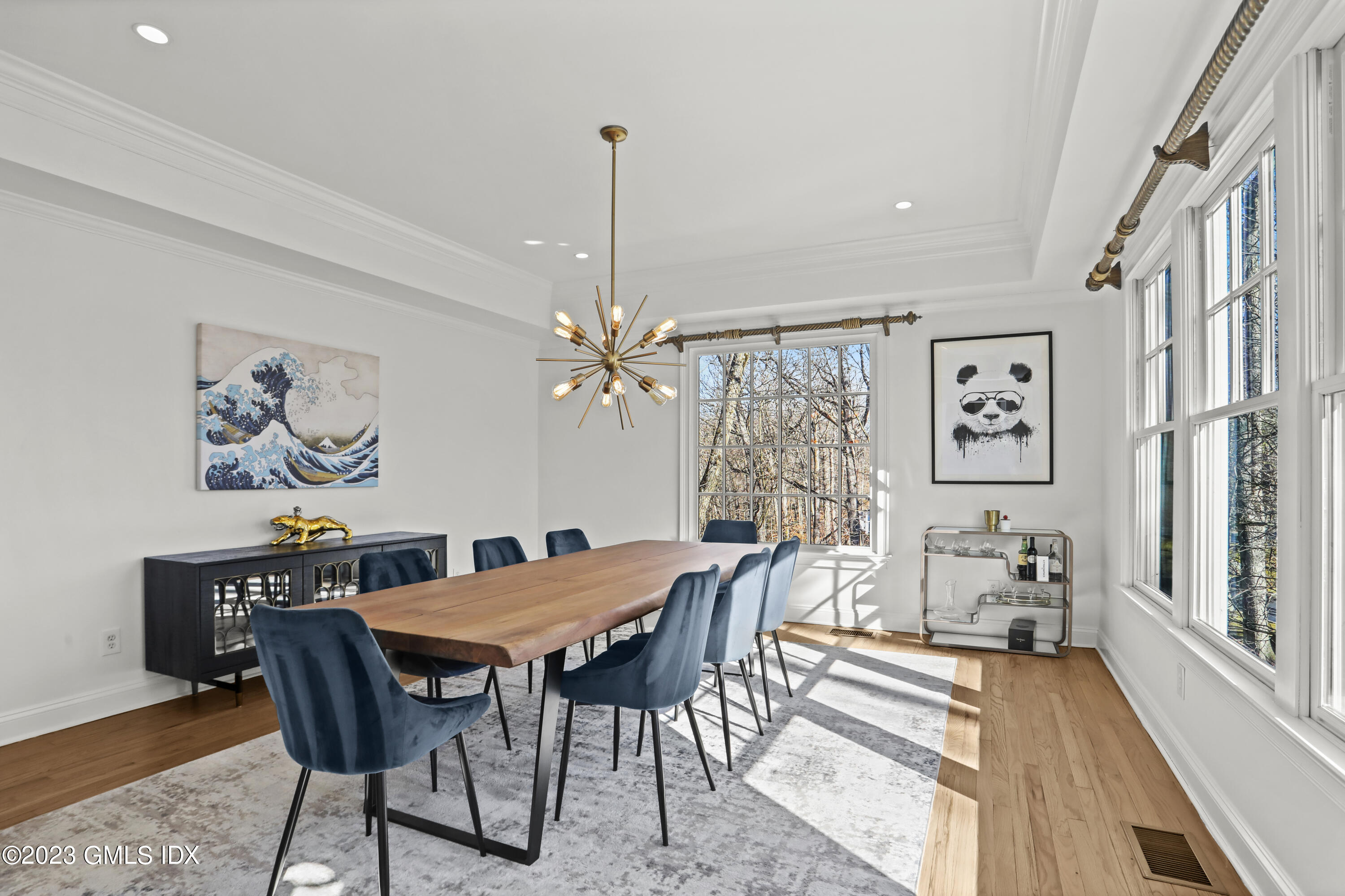 192 Bible Street Cos Cob, CT 06807 - Photo 14 of 32 a view of a dining room with furniture a chandelier and wooden floor