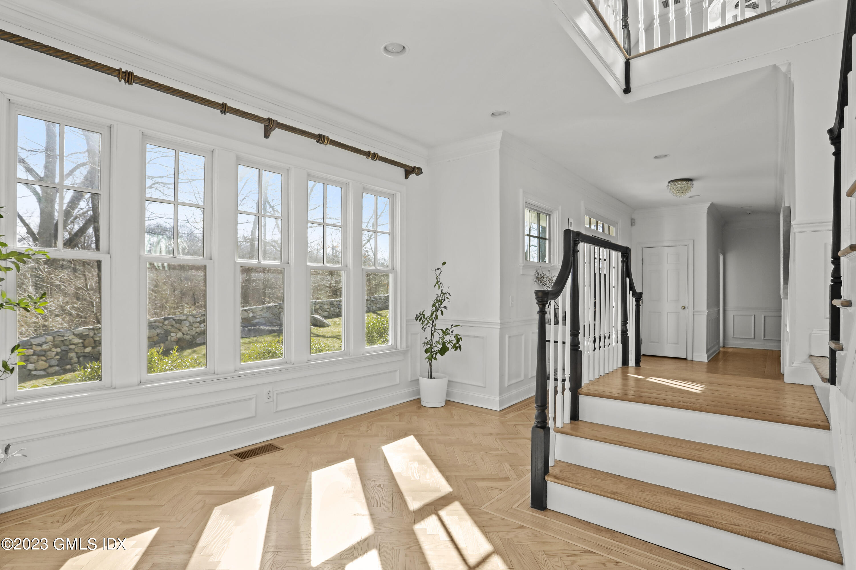 192 Bible Street Cos Cob, CT 06807 - Photo 16 of 32 a view of an entryway with wooden floor and windows